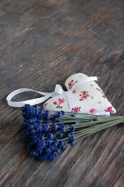 Lavender flowers and lavender bag on table — Stockfoto