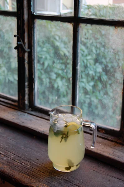 Fresh made lemonade with mint, with old wooden window background — Stock Photo, Image