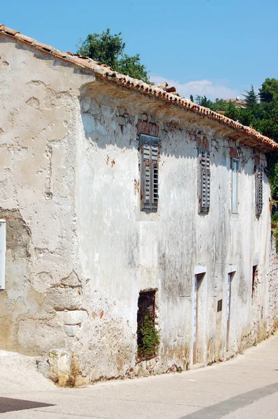 detail of old building's facade with windows