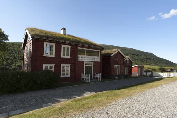 Typical red scandinavian wooden house with grassy roof, Norway — Stock Photo, Image