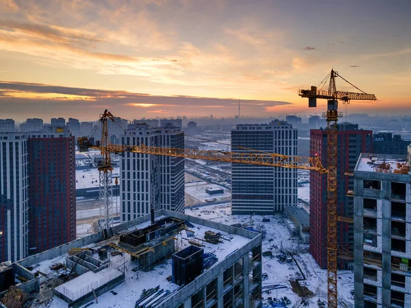 Drone photo of residential construction site against sunrise sky