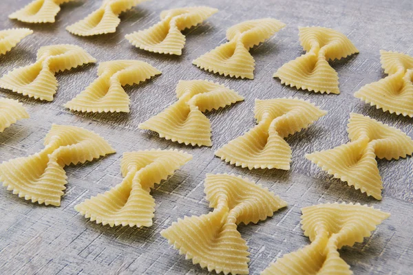 Uncooked pasta background — Stock Photo, Image