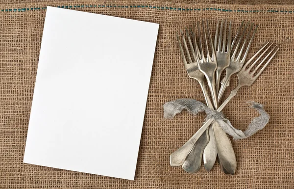 White  paper and  vintage forks Royalty Free Stock Images