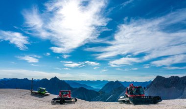 Germany's highest mountain the Zugspitze in Bavaria With the train station and summer tourism and the snow crawlers on the slope