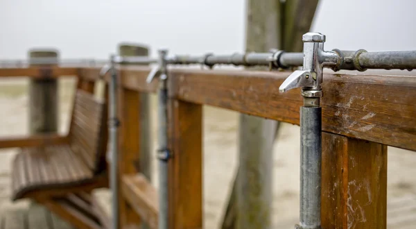 A faucet on the beach of the North Sea — Stock Photo, Image