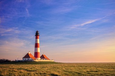 The lighthouse of Westerhever North Sea coast at the clipart