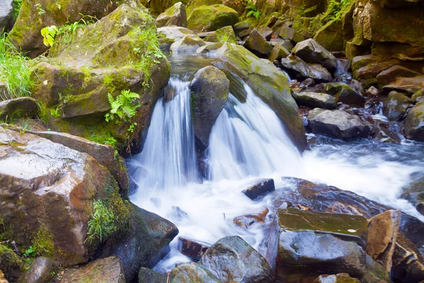 stock image Small waterfall on mountain river long exposure. Forest in the Carpathia, Ukraine