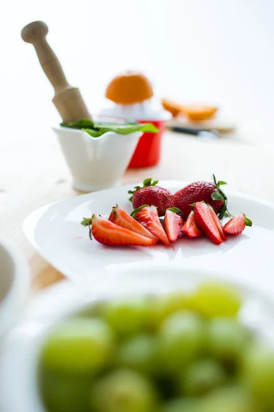 Grapes, strawberries, mint and orange. — Stock Photo, Image