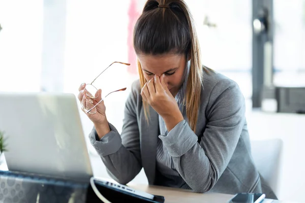Shot Exhausted Young Woman Headache Working Her Laptop Office — Stock Photo, Image
