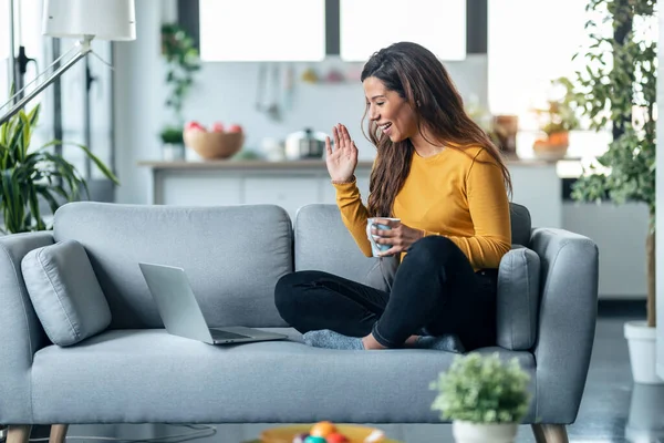 Shot Beautiful Young Woman Having Videocall Laptop While Drinking Cup — Φωτογραφία Αρχείου