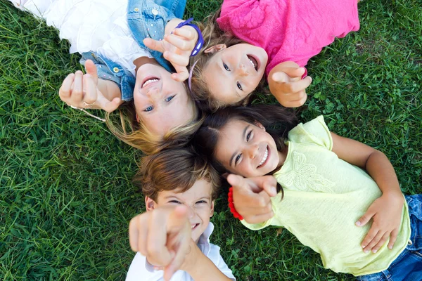 Group of childrens having fun in the park. — Stock Photo, Image