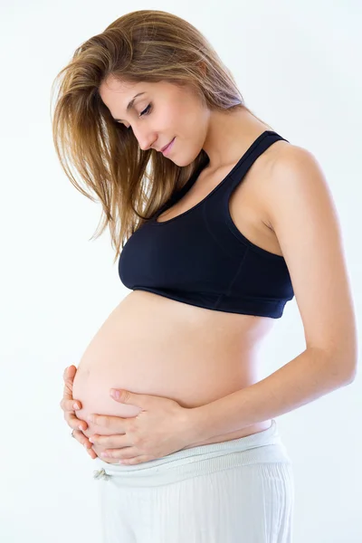 Güzel, hamile bir kadın. Beyaz bir arka plan üzerinde izole — Stok fotoğraf