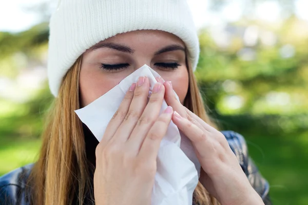 Portrait of beautiful girl with tissue having flu or allergy. — Stock Photo, Image