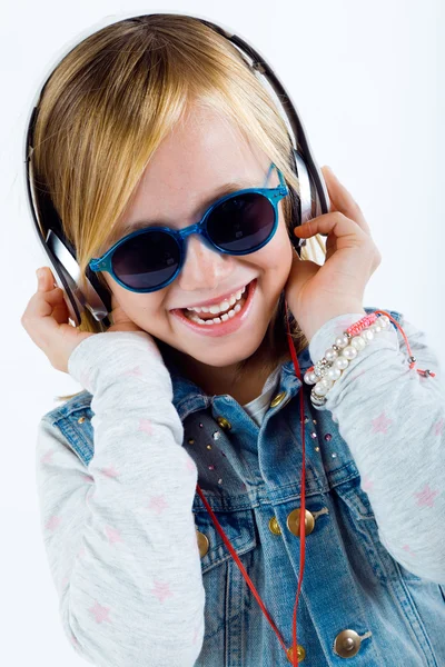 Beautiful child listening to music with digital tablet. — Stock Photo, Image