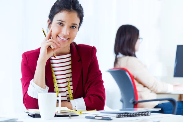 Two young businesswomen working in her office. — Stock Photo, Image