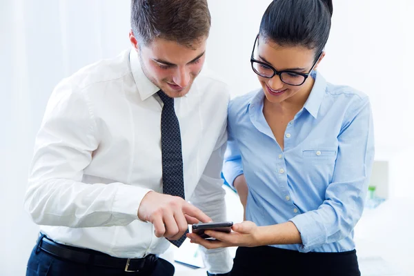 Business people working in the office with mobile phone. — Stock Photo, Image