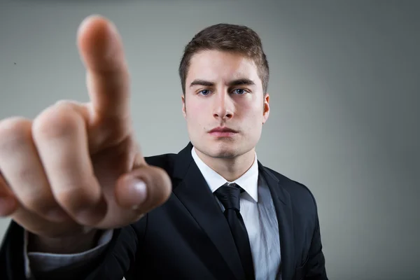 Business man with pointing to something or touching a screen. — Stock Photo, Image