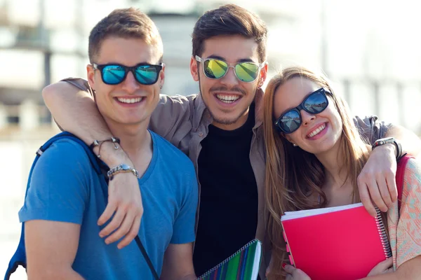 A group of friends talking in the street after class. — Stock Photo, Image