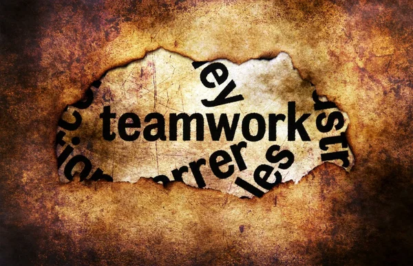 Teamwork text on paper hole grunge concept — Stock Photo, Image