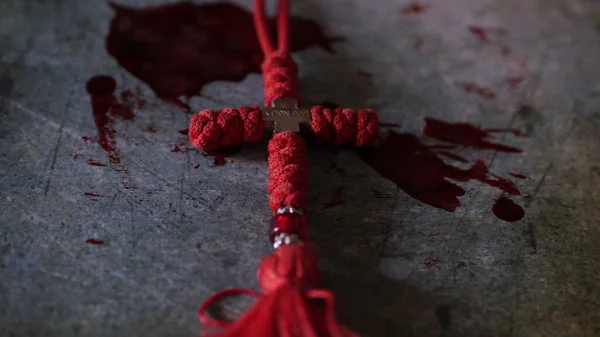 Close up of cross of jesus on bloody background