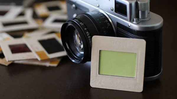 Close up of vintage film camera and slide films