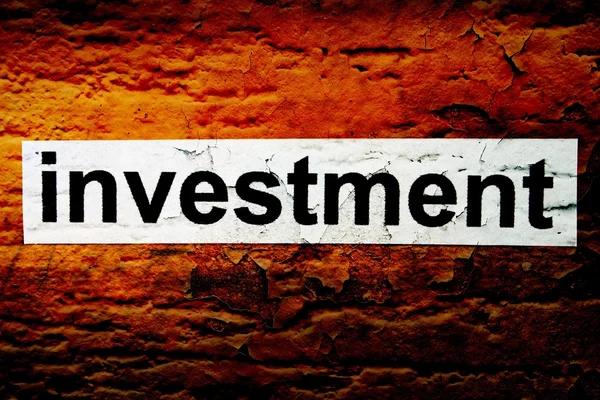 Investitionstext auf Grunge-Hintergrund — Stockfoto