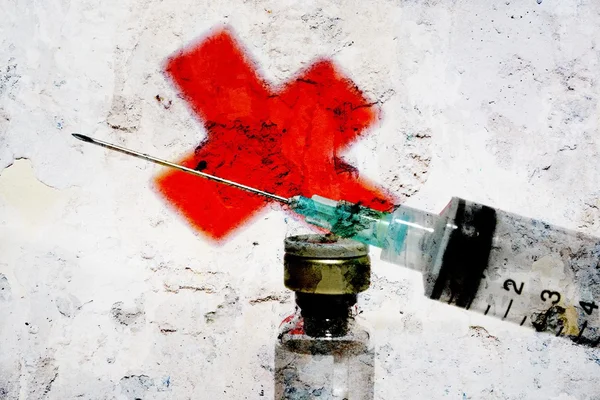 Syringe and red cross — Stock Photo, Image