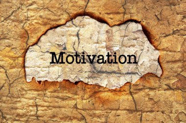 motivasyon metin üzerinde kağıt delik