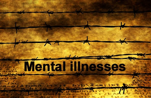 Mental illnesses text against barbwire — 图库照片