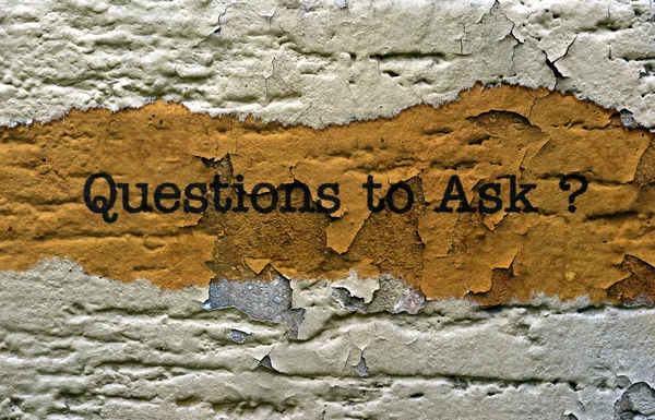 Questions to ask text on grunge background — Stock fotografie