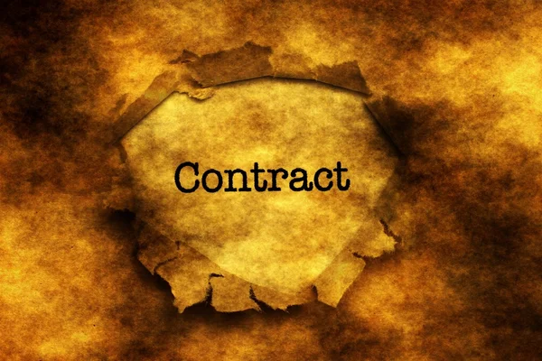 Contract text on grunge paper hole — Stockfoto