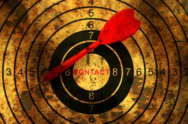 Dart on grunge contact target — ストック写真