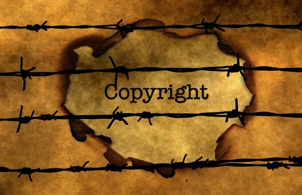 Autorských práv koncepce proti barbwire — Stock fotografie