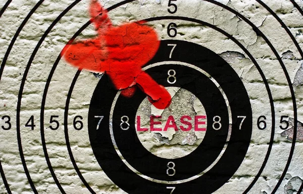 Lease target op grunge achtergrond — Stockfoto