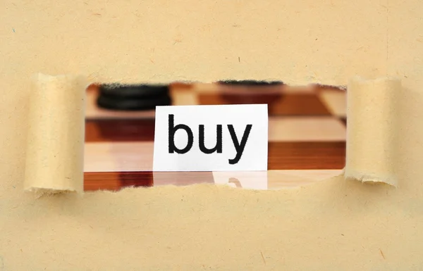 Label op gescheurd papier kopen — Stockfoto