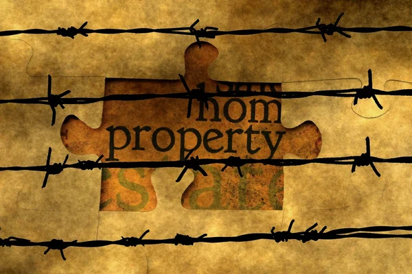 Property puzzle concept against barbwire — Stock Photo, Image