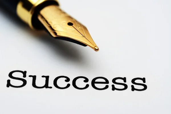 Fountain pen on success text — Stock Photo, Image