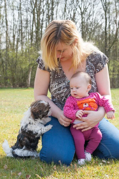 Mother her baby and puppy — Stock Photo, Image