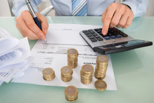 Businessman Calculating Invoice — Stock Photo, Image