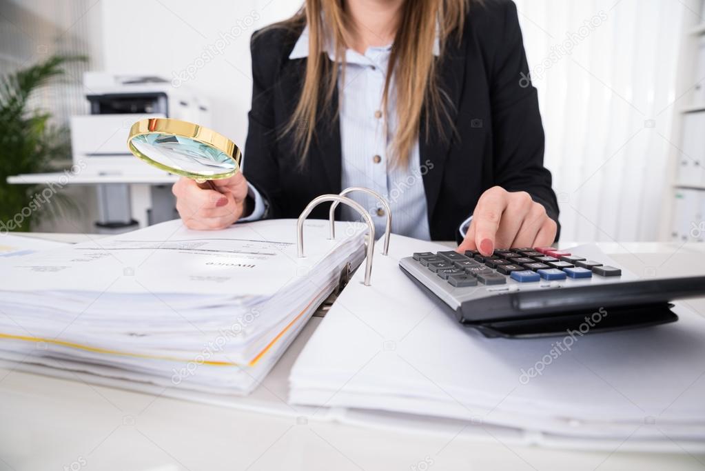 Businesswoman Checking Invoice