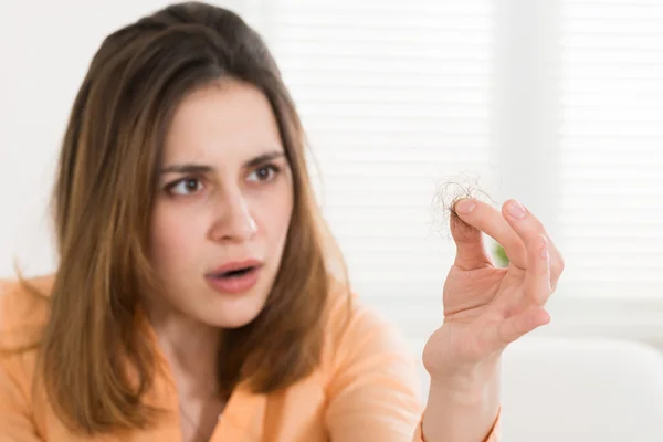 Woman Holding Loss Hair — Stock Photo, Image