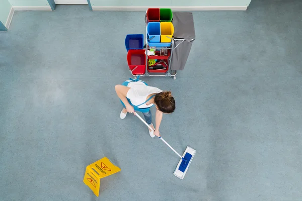 Female Janitor Mopping Floor — Stock Photo, Image