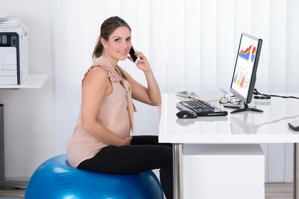 Businesswoman On Fitness Ball While — Stock Photo, Image