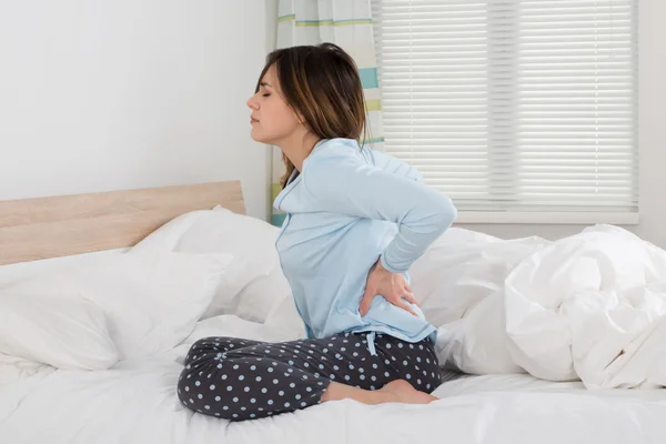 Young Woman Suffering From Back Pain — Stock Photo, Image