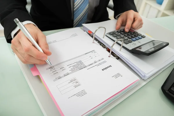 Businessman Calculating Invoice — Stock Photo, Image