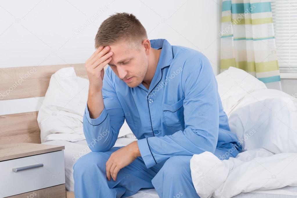 Young Man Suffering From Headache