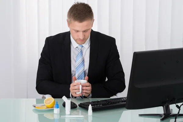 Sick Businessman Holding Cup — Stock Photo, Image