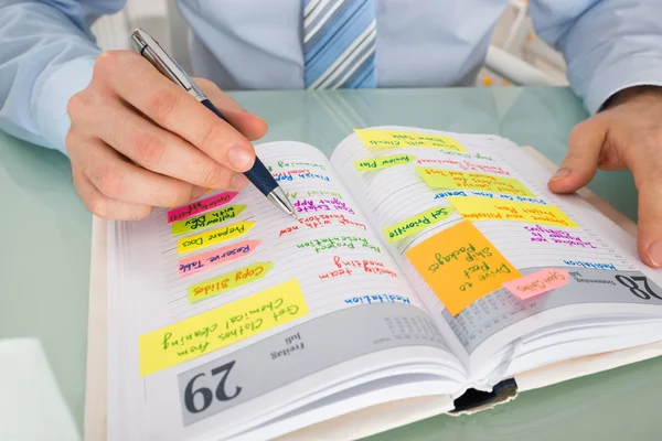 Businessman Writing Note In Diary — Stock Photo, Image