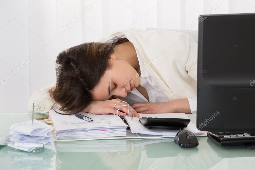Businesswoman Sleeping On Desk