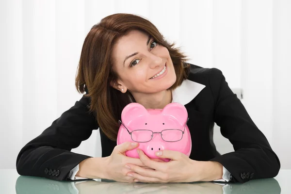 Businesswoman Holding Piggybank — Stock Photo, Image